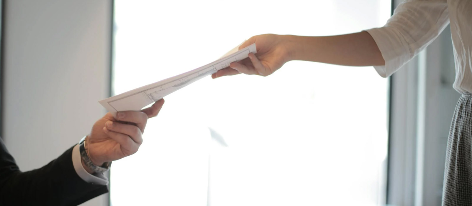 People Exchanging Documents